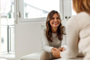 Therapist talks to patient about mental health resources in Texas